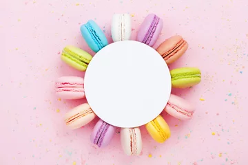 Foto op Canvas Mockup with colorful macaron or macaroon on pink pastel background top view. Flat lay composition. © juliasudnitskaya