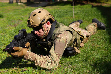 Airsoft player, soldier with weapon