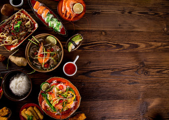 Various of asian meals on rustic background , top view , place for text.