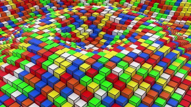 Colorful plastic cubes moving up and down in ripples.
Loop ready animation of multi colored boxes.