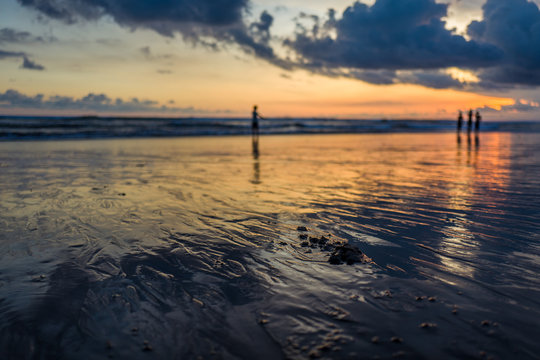 Sunset at Pantai Batu Bolong Beach on Bali, Indonesia.