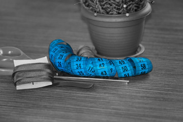 Sewing accessories on table, colored spools of thread