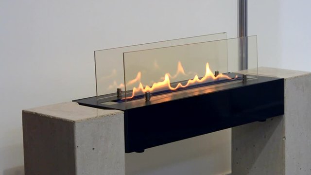 Modern bio fireplot fireplace on ethanol gas. Smart ecological alternative technologies. Contemporary biofuel on ethanol close-up. Energy saving innovation. Interior inside a house
