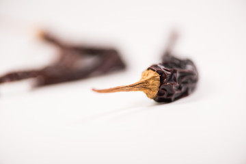 Dried red chili or chilli cayenne pepper isolated on white background cutout