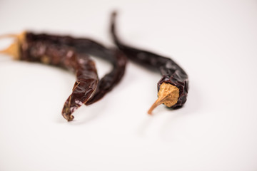 Dried red chili or chilli cayenne pepper isolated on white background cutout