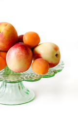Glass plate with peaches, apricots and nectarines