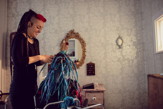Beautician styling clients hair