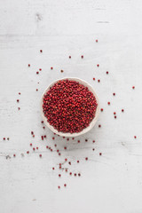 Top of wiev red peppercorn on white concrete board