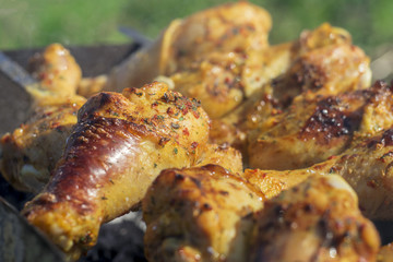 .Preparation of chicken legs on the grill