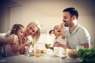 Family in kitchen.