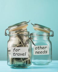 Bank for money, piggy bank, savings, for travel, vacation plans. On the table is a blue background.