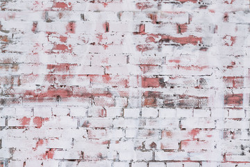 Wall texture with brick patterns with unevenly painted white paint, abstract light background