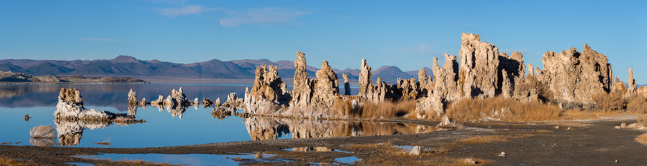 Sunset at Mono lake, California. Bizarre calcareous tufa formation on the smooth water of the lake.