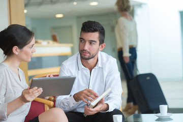 People having a coffee while discussing business