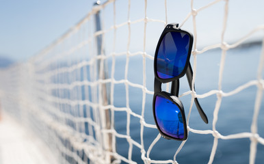 Picture of cool sunglasses hanging on net