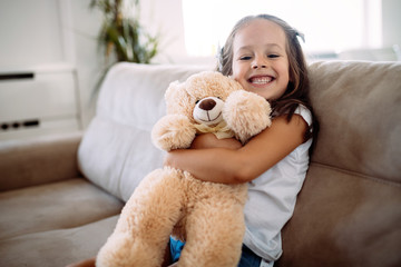 Young girl playing with her favourite toy