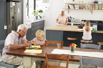 Grandparents and grandkids in family kitchen, elevated view