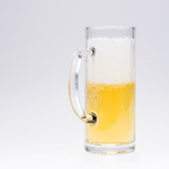 Big glass of beer isolated on a light background