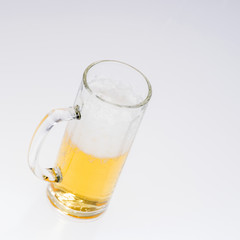 Big glass of beer isolated on a light background