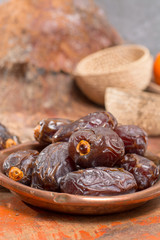 Traditional Middle East dessert, healthy food, big medjool dates fruits.