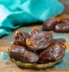 Traditional Middle East dessert, healthy food, big medjool dates fruits.