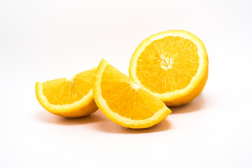 Orange slices and half on a white background