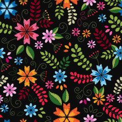 Embroidery seamless pattern texture wallpaper, background, with cute flowers and leaves. Vector floral ornament on black background. Template for design, printing, textiles, clothing