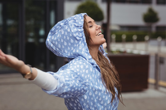 Beautiful woman enjoying rain