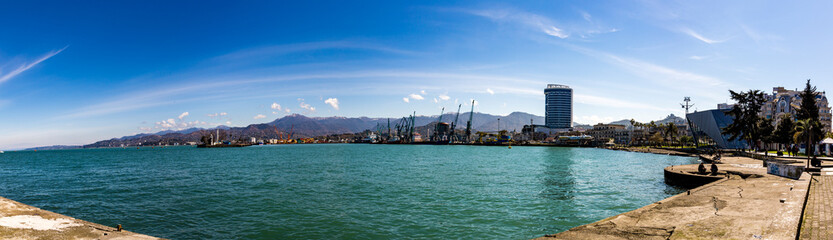 Naklejka premium BATUMI, GEORGIA - MARCH 17, 2018: Black Sea coast near the city port 