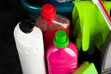 Cleaning supplies on black background
