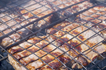 .Pork steak baked on the grill