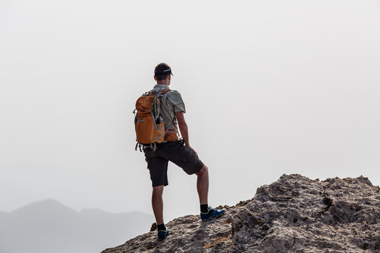Man climbing hiking inspiration landscape, travel concept