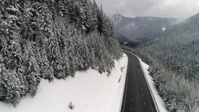 Red Truck Swerving Snowy Mountain Highway Aerial