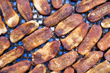 Sun-dried bananas on a street, top view. Asian street food.