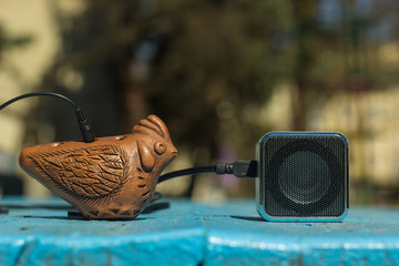 okarina folk music instrument on unfocused colorful background space