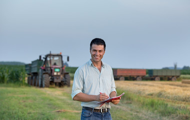 Farmer and tractor in field