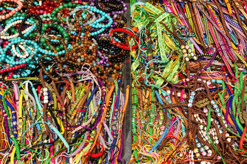 A lot of colorful bracelets on a street market.