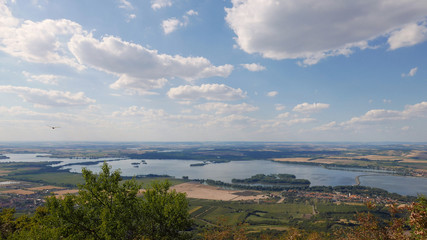 Clouds passing blue lakes landscape time lapse in Moravia