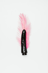 Black dildo toy with pink feather isolated on white