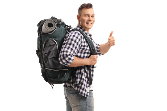 Tourist with a backpack making a thumb up gesture