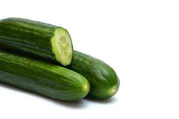 Three cucumbers on a white background.