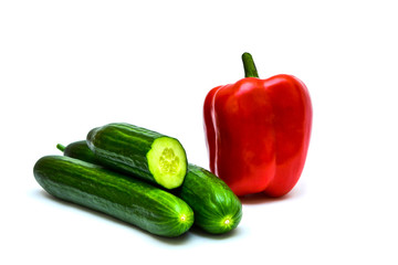 sweet red bell pepper and cucumber on a white background