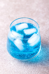 Ice Blue cocktail with thyme. Blue curacao liqueur. Summer