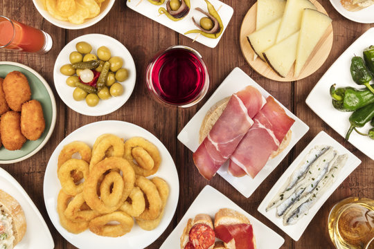 Spanish food. Overhead photo of many different tapas with wine