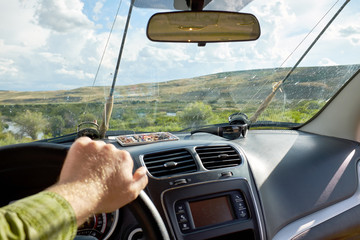 Man driving a vehicle off road on a fishing trip