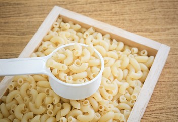 Elbow Macaroni or Gomiti Pasta in Measuring Cup