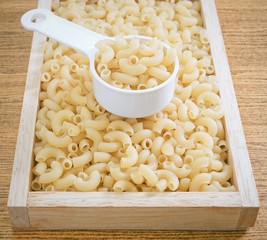 Elbow Macaroni or Gomiti Pasta in Measuring Cup