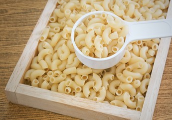 Elbow Macaroni or Gomiti Pasta in Measuring Cup