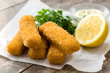 crispy fried fish fingers on wooden table