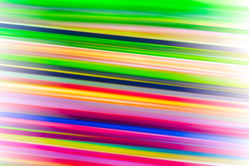 Heap of blurred colorful drinking straws.